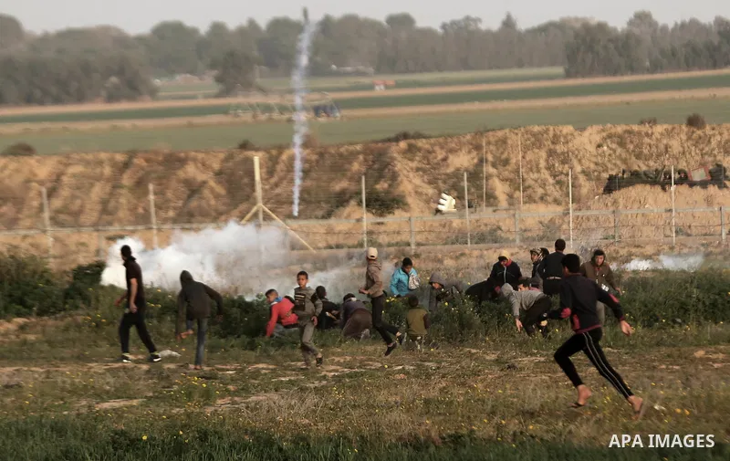 Palestinian protesters clash with Israeli troops following the tents protest where Palestinians demand the right to return to their homeland at the Israel-Gaza border, in Khan Younis in the southern Gaza strip, February...