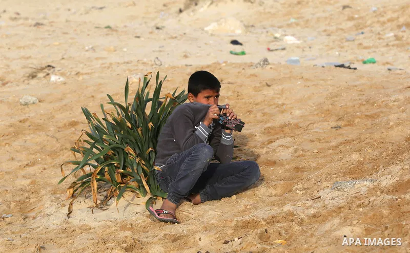 Palestinian demonstrators protest on the beach along the northern Gaza border, across from the Israeli settlement of Kibbutz Zikim, on February 12, 2019, as part of weekly maritime protests against the naval blockade of...