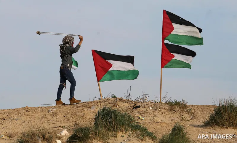 Palestinian demonstrators protest on the beach along the northern Gaza border, across from the Israeli settlement of Kibbutz Zikim, on February 12, 2019, as part of weekly maritime protests against the naval blockade of...