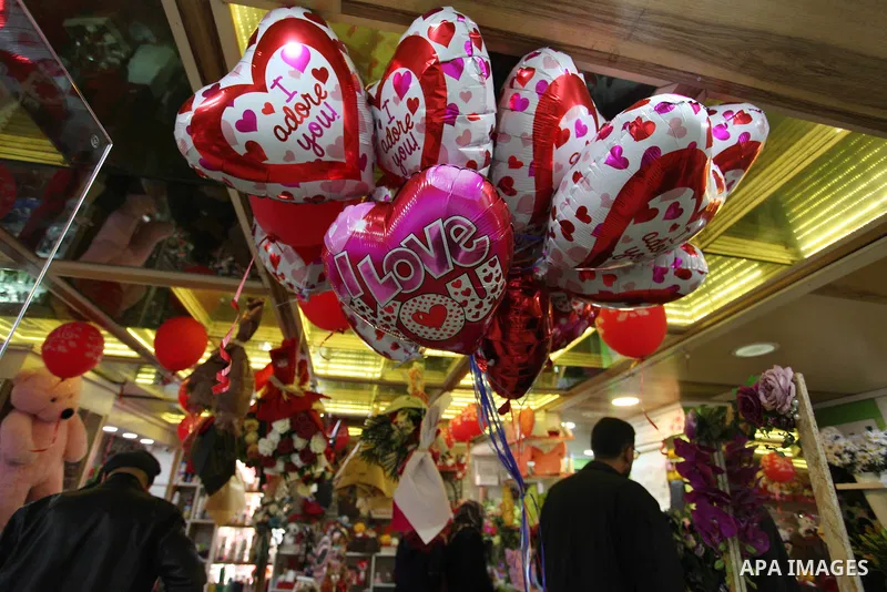 Palestinian vendors display flowers, red teddy bears, red ballons and pillows on Valentine's day, in Gaza city on February 14, 2019. Valentine's Day is increasingly popular in the region as people have taken up the custo...