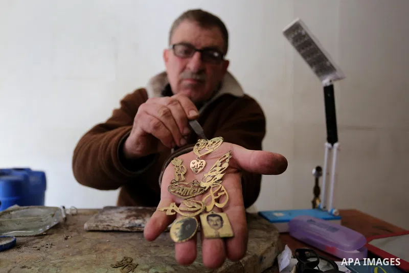 A Palestnian goldsmith Nicolae Terzi, 62, makes jewellery at his workshop, in Khan Younis in the southern of Gaza strip, on February 14, 2019. Terzi has jewellery-making skills as he trained in the profession in Italy si...