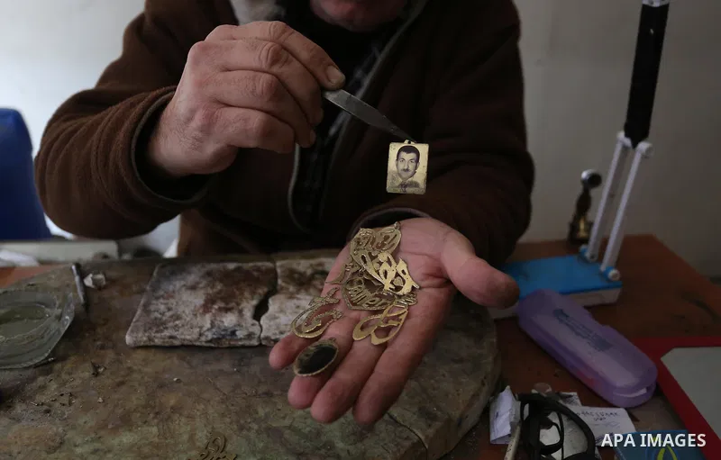 A Palestnian goldsmith Nicolae Terzi, 62, makes jewellery at his workshop, in Khan Younis in the southern of Gaza strip, on February 14, 2019. Terzi has jewellery-making skills as he trained in the profession in Italy si...