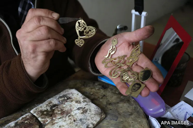 A Palestnian goldsmith Nicolae Terzi, 62, makes jewellery at his workshop, in Khan Younis in the southern of Gaza strip, on February 14, 2019. Terzi has jewellery-making skills as he trained in the profession in Italy si...