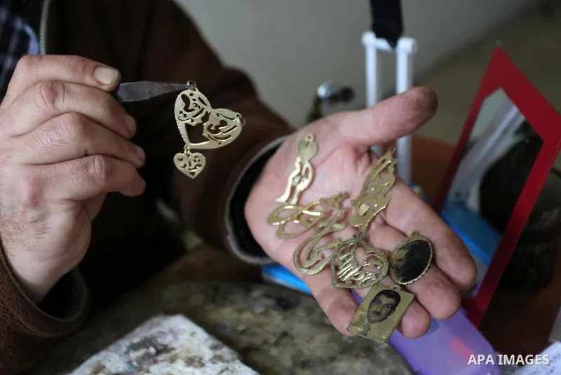 A Palestnian goldsmith Nicolae Terzi, 62, makes jewellery at his workshop, in Khan Younis in the southern of Gaza strip, on February 14, 2019. Terzi has jewellery-making skills as he trained in the profession in Italy si...