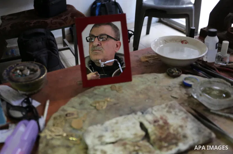 A Palestnian goldsmith Nicolae Terzi, 62, makes jewellery at his workshop, in Khan Younis in the southern of Gaza strip, on February 14, 2019. Terzi has jewellery-making skills as he trained in the profession in Italy si...