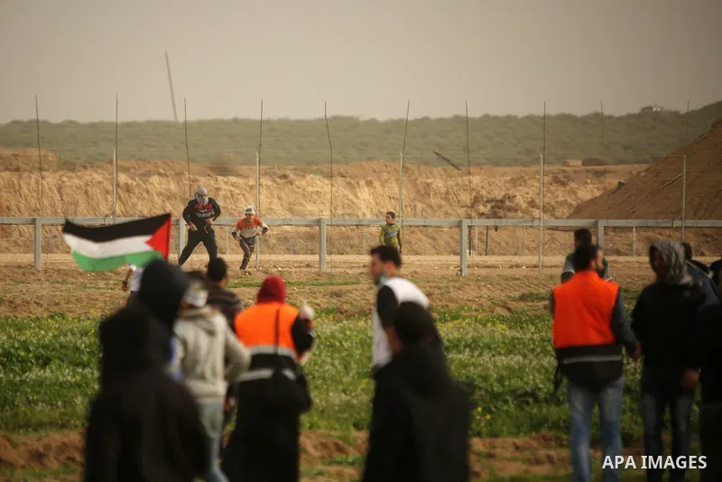 Palestinian protesters clash with Israeli troops following the tents protest where Palestinians demand the right to return to their homeland at the Israel-Gaza border, in the east of Gaza city, February 15, 2019. At leas...