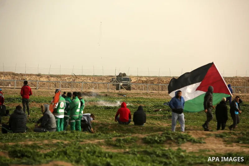 Palestinian protesters clash with Israeli troops following the tents protest where Palestinians demand the right to return to their homeland at the Israel-Gaza border, in the east of Gaza city, February 15, 2019. At leas...