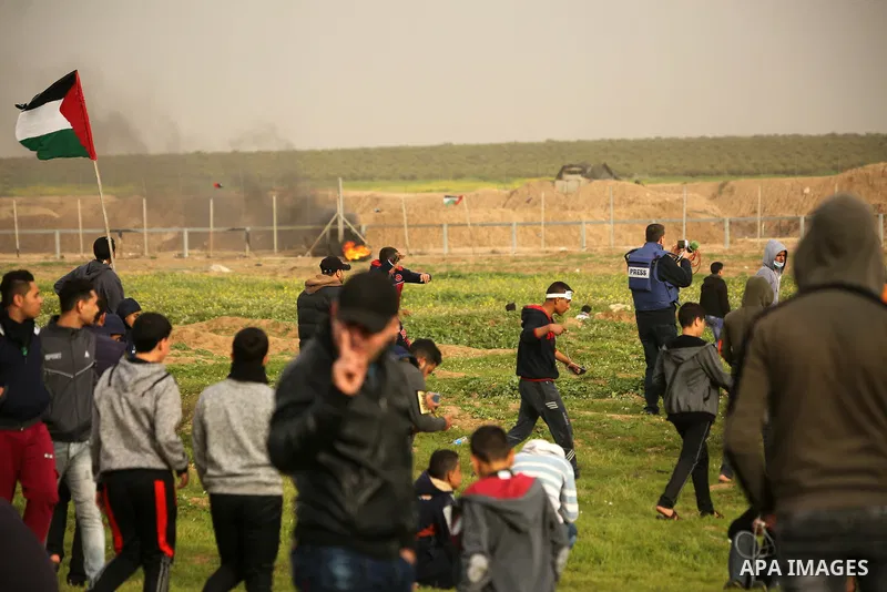 Palestinian protesters clash with Israeli troops following the tents protest where Palestinians demand the right to return to their homeland at the Israel-Gaza border, in the east of Gaza city, February 15, 2019. At leas...