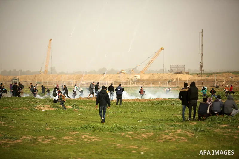 Palestinian protesters clash with Israeli troops following the tents protest where Palestinians demand the right to return to their homeland at the Israel-Gaza border, in the east of Gaza city, February 15, 2019. At leas...