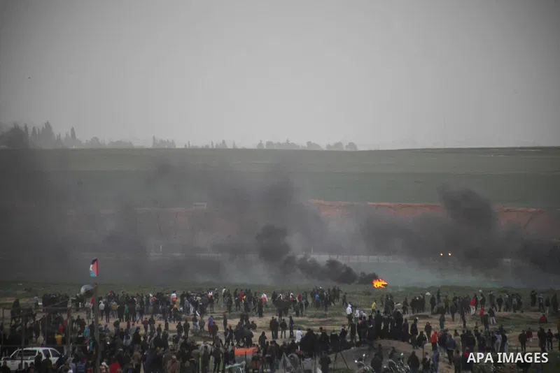 Palestinian protesters gather during clashes with Israeli troops in tents protest where Palestinians demand the right to return to their homeland at the Israel-Gaza border, in Jabalia in the northern Gaza Strion February...