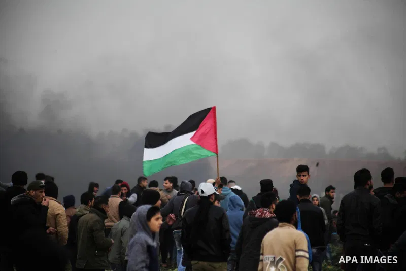 Palestinian protesters gather during clashes with Israeli troops in tents protest where Palestinians demand the right to return to their homeland at the Israel-Gaza border, in Jabalia in the northern Gaza Strion February...