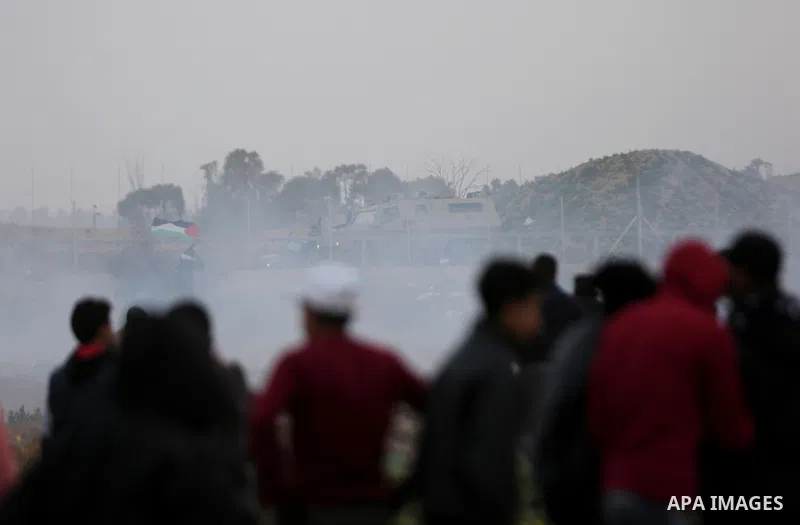 Palestinian protesters gather during clashes with Israeli troops in tents protest where Palestinians demand the right to return to their homeland at the Israel-Gaza border, in Khan Younis in the southern Gaza Strip, on F...