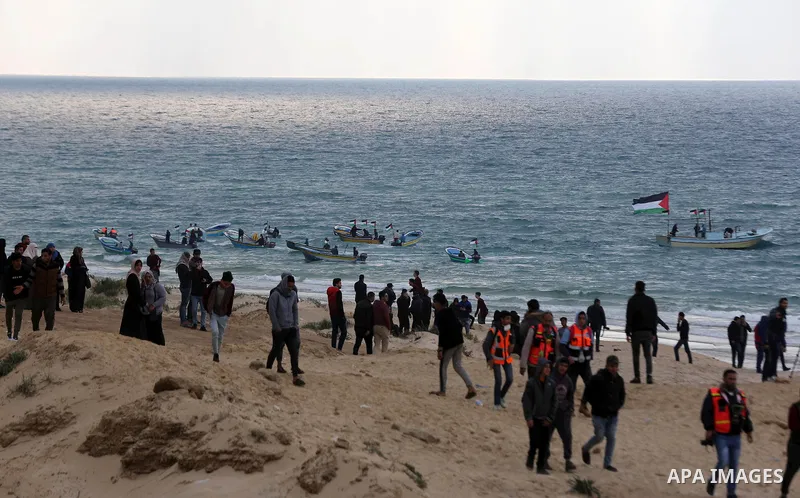 Palestinian demonstrators protest on the beach along the northern Gaza border, across from the Israeli settlement of Kibbutz Zikim, on February 19, 2019, as part of weekly maritime protests against the naval blockade of...