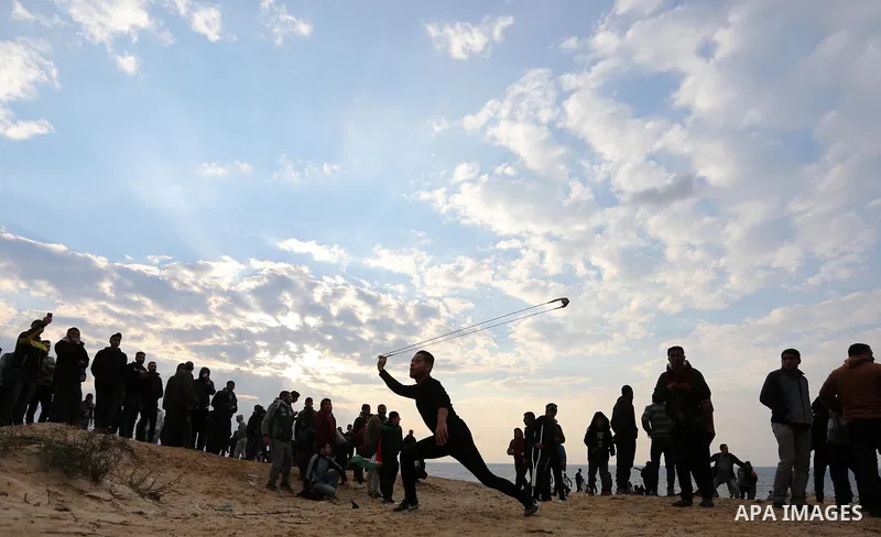 Palestinian demonstrators protest on the beach along the northern Gaza border, across from the Israeli settlement of Kibbutz Zikim, on February 19, 2019, as part of weekly maritime protests against the naval blockade of...