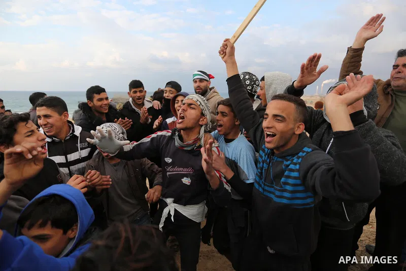 Palestinian demonstrators protest on the beach along the northern Gaza border, across from the Israeli settlement of Kibbutz Zikim, on February 19, 2019, as part of weekly maritime protests against the naval blockade of...
