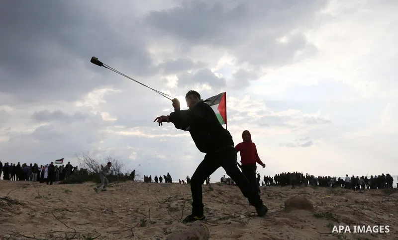 Palestinian demonstrators protest on the beach along the northern Gaza border, across from the Israeli settlement of Kibbutz Zikim, on February 19, 2019, as part of weekly maritime protests against the naval blockade of...