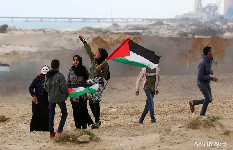 Palestinian demonstrators protest on the beach along the northern Gaza border, across from the Israeli settlement of Kibbutz Zikim, on February 19, 2019, as part of weekly maritime protests against the naval blockade of...