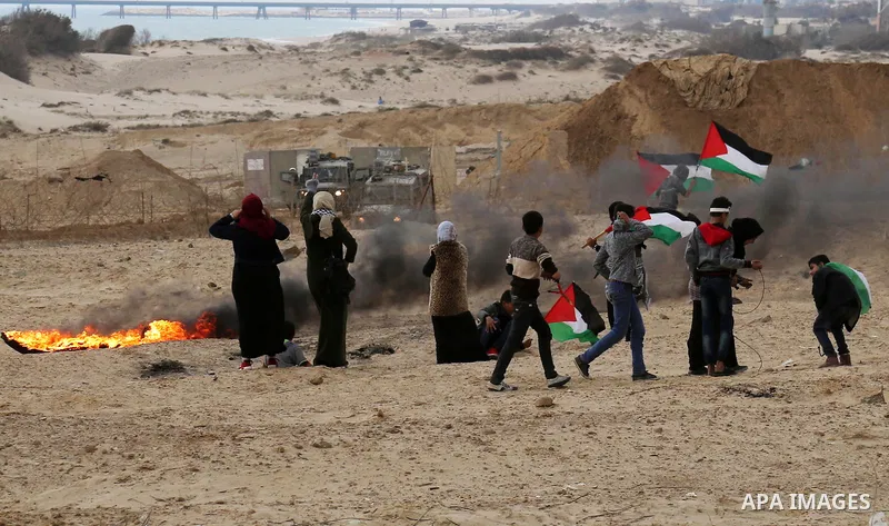 Palestinian demonstrators protest on the beach along the northern Gaza border, across from the Israeli settlement of Kibbutz Zikim, on February 19, 2019, as part of weekly maritime protests against the naval blockade of...
