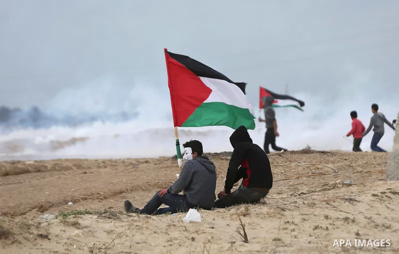 Palestinian demonstrators protest on the beach along the northern Gaza border, across from the Israeli settlement of Kibbutz Zikim, on February 19, 2019, as part of weekly maritime protests against the naval blockade of...