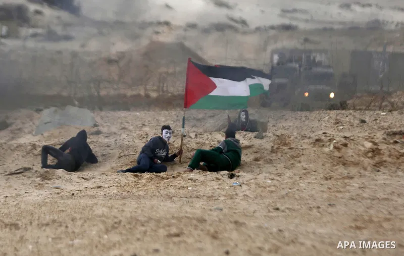 Palestinian demonstrators protest on the beach along the northern Gaza border, across from the Israeli settlement of Kibbutz Zikim, on February 19, 2019, as part of weekly maritime protests against the naval blockade of...