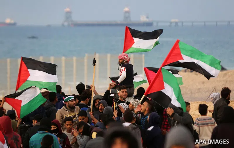 Palestinian demonstrators protest on the beach along the northern Gaza border, across from the Israeli settlement of Kibbutz Zikim, on February 19, 2019, as part of weekly maritime protests against the naval blockade of...