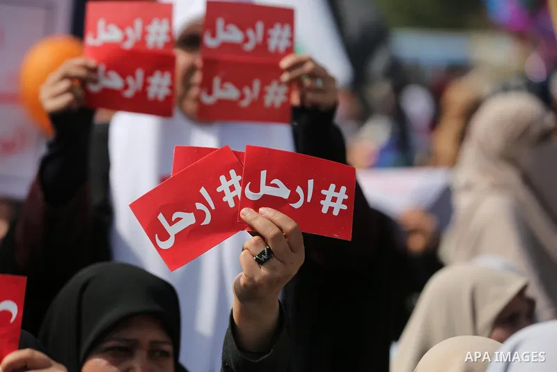 Palestinians take part in a protest against decisions of the Palestinian president Mahmoud Abbas, in Gaza city, on February 24, 2019. Photo by Ashraf Amra