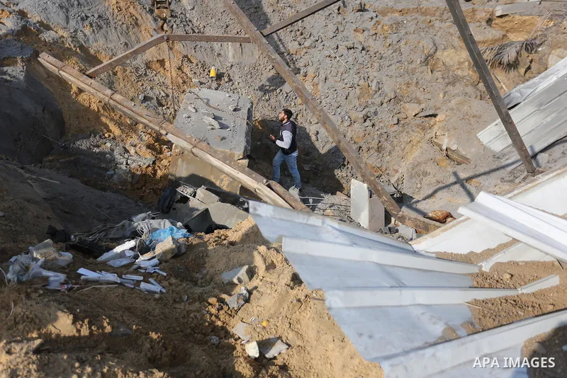 Palestinian men inspect the seaport targeted by an Israeli air strike, in Khan Yunis in the southern of Gaza Strip, on March 7, 2019. Photo by Ashraf Amra