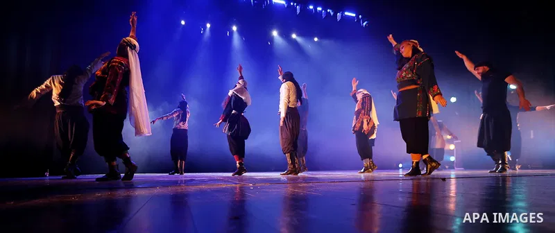 Palestinian members of "Weshah" dancing band, perform during at Ramallah cultural palace theater, in the West Bank city of Ramallah, March 17, 2019. Photo by Mohammed Nofal / WAFA / APAimages