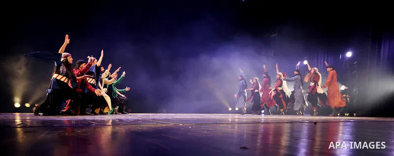 Palestinian members of "Weshah" dancing band, perform during at Ramallah cultural palace theater, in the West Bank city of Ramallah, March 17, 2019. Photo by Mohammed Nofal / WAFA / APAimages