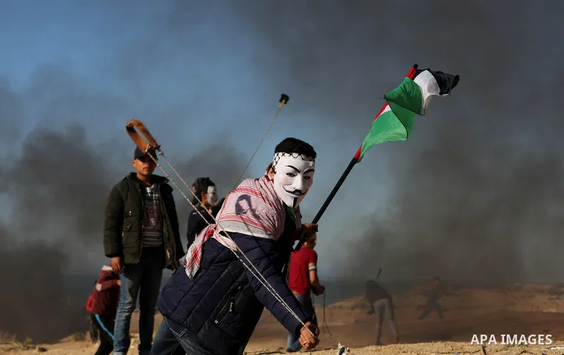 Palestinian demonstrators take part in a protest on the beach along the northern Gaza border, across from the Israeli settlement of Kibbutz Zikim, on March19, 2019, as part of weekly maritime protests against the naval b...