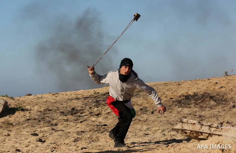 Palestinian demonstrators take part in a protest on the beach along the northern Gaza border, across from the Israeli settlement of Kibbutz Zikim, on March19, 2019, as part of weekly maritime protests against the naval b...
