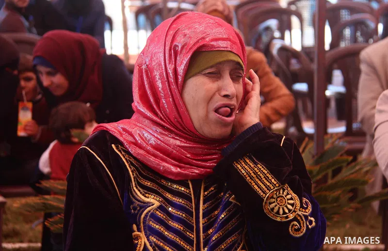 Palestinian elderly take part during a celebration on the occasion of Mother's Day, at el-Wafa elderly nursing home in Gaza city, on March 21, 2019. Mother's Day is a celebration honoring the mother of the family, as wel...