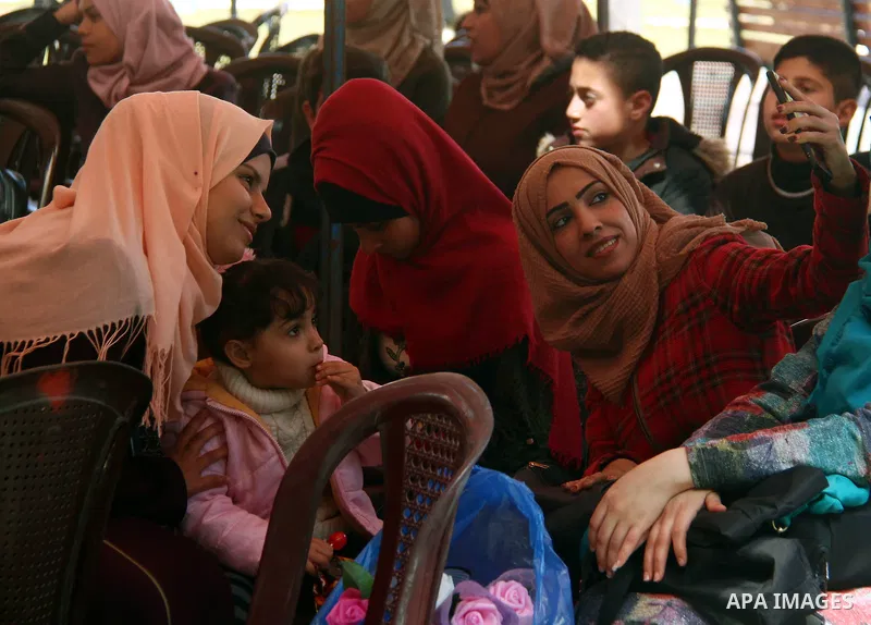 Palestinian elderly take part during a celebration on the occasion of Mother's Day, at el-Wafa elderly nursing home in Gaza city, on March 21, 2019. Mother's Day is a celebration honoring the mother of the family, as wel...