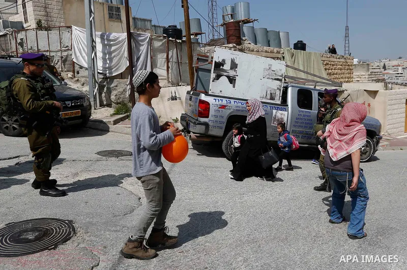 Israeli settlers celebrate the Jewish holiday of Purim, in the West Bank city of Hebron, on March 21, 2019. Purim is a celebration of the Jews' salvation from genocide in c, as recounted in the Book of Esther. Photo by W...