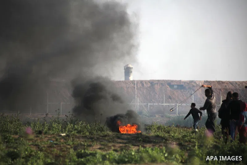 Palestinian protesters clash with Israeli troops following the tents protest where Palestinians demand the right to return to their homeland at the Israel-Gaza border, in Jabalia in the northern Gaza Strip, March 22, 201...