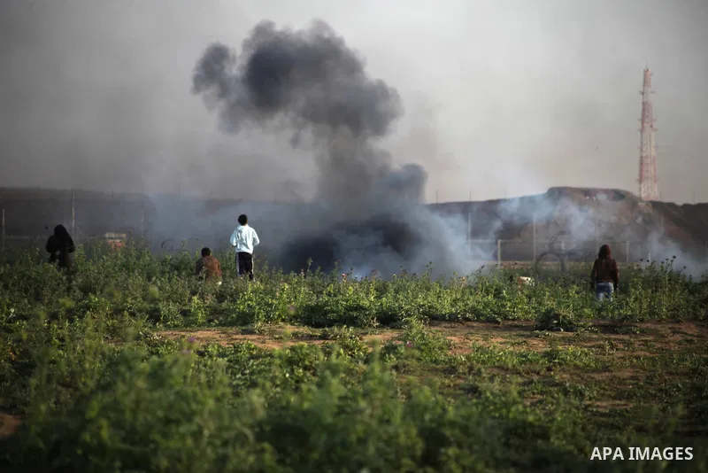 Palestinian protesters clash with Israeli troops following the tents protest where Palestinians demand the right to return to their homeland at the Israel-Gaza border, in Jabalia in the northern Gaza Strip, March 22, 201...