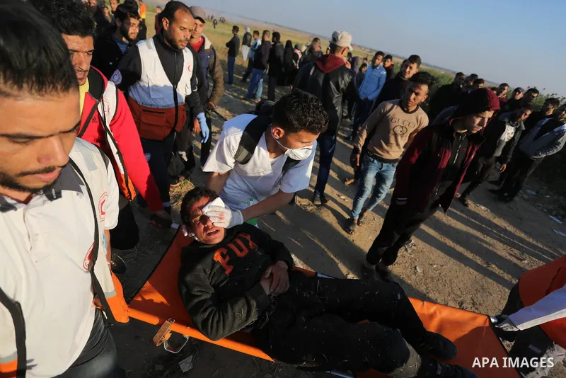 A wounded Palestinian protester is evacuated during clashes with Israeli troops following the tents protest where Palestinians demand the right to return to their homeland at the Israel-Gaza border, in Khan Younis in the...
