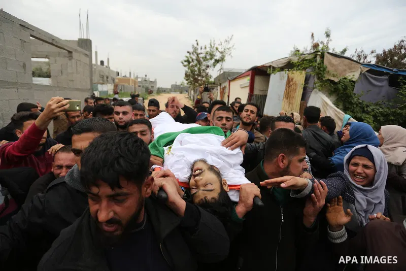 Mourners carry the body of Palestinian Habib Al Masry, 24, who was shot dead by Israeli forces during clashes with Israeli troops in tents protest where Palestinians demand the right to return to their homeland at the Is...