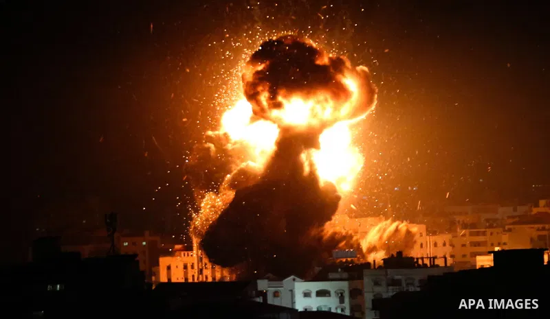 A ball of fire is seen following an Israeli air strike on building believed to house the offices of Hamas chief in Gaza, Ismail Haniyeh, during Israeli strikes on the Gaza City, March 25, 2019. Israel launched air strike...