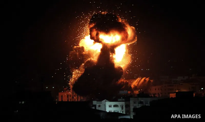 A ball of fire is seen following an Israeli air strike on building believed to house the offices of Hamas chief in Gaza, Ismail Haniyeh, during Israeli strikes on the Gaza City, March 25, 2019. Israel launched air strike...