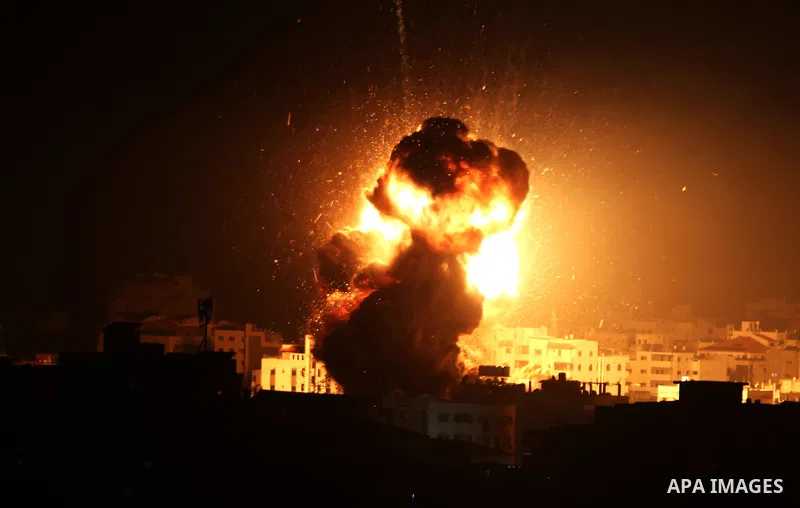 A ball of fire is seen following an Israeli air strike on building believed to house the offices of Hamas chief in Gaza, Ismail Haniyeh, during Israeli strikes on the Gaza City, March 25, 2019. Israel launched air strike...