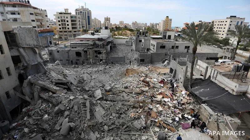 Palestinians inspect a security Hamas site that was damaged in an Israeli airstrike in Gaza city, on March 26, 2019. Israeli forces carried out strikes across the Gaza Strip, after an earlier rocket attack that destroyed...