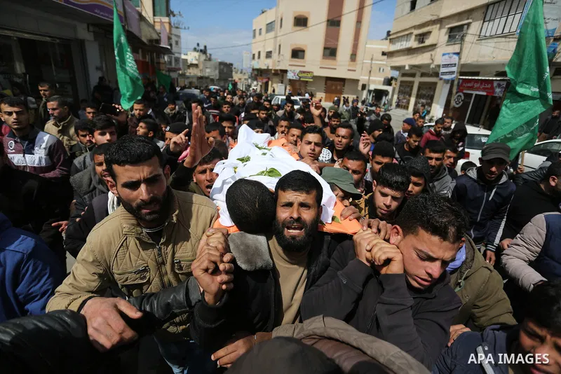 Mourners carry the body of Palestinian Bilal al-Najjar, 17, who was shot dead by Israeli forces at the Israel-Gaza border, during his funeral in Khan Younis in the southern of Gaza strip, on March 31, 2019. Photo by Ashr...