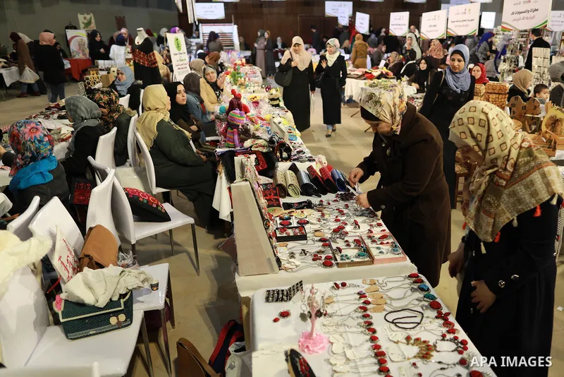 Palestinians attend a heritage exhibition displaying women's works, in Gaza city on April 01, 2019. Photo by Mahmoud Nasser