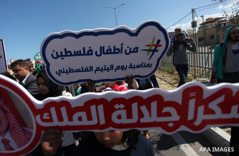 Palestinian orphans take part in a march to mark the Orphan Day, in Gaza city, on April 10, 2019. Photo by Mahmoud Ajjour