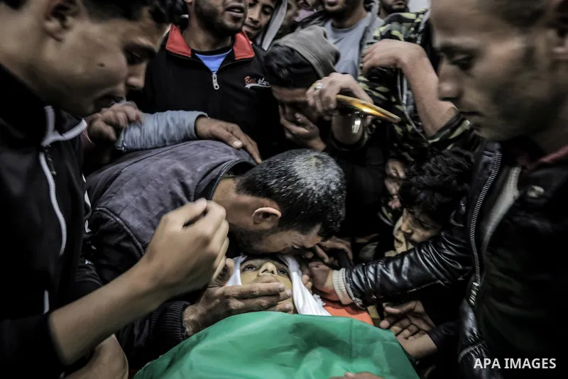 Relatives of Palestinian teenager Maysara Shallof mourn during his funeral in Beit Hanoun in the northern Gaza Strip on April 12, 2019. Israeli troops shot dead a Palestinian teenager taking part in protests along the Ga...