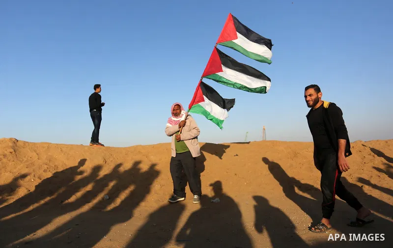 Palestinian protesters clash with Israeli troops following the tents protest where Palestinians demand the right to return to their homeland at the Israel-Gaza border, in Khan Younis in the southern Gaza Strip, April 12,...