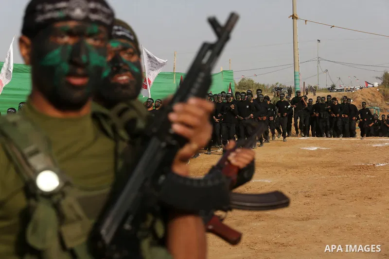 Palestinian militants of al-Mujahideen Brigades, show their military skills during a graduation ceremony, in Gaza city on April 24, 2019. Photo by Ashraf Amra