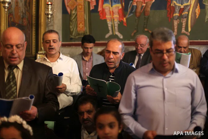 Palestinian Orthodox Christians gather at the Church of Saint Porphyrius as they celebrated the Good Friday procession, in Gaza city on April 26, 2019. Photo by Mahmoud Ajjour
