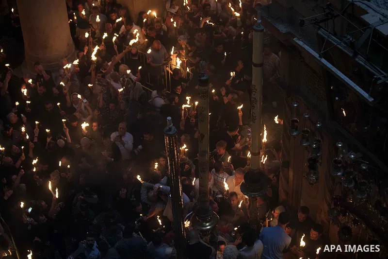 Orthodox Christian worshippers attend the Holy Fire ceremony in the Church of the Holy Sepulchre in Jerusalem's Old City, on April 27, 2019. Eastern Faithful believe that the Holy Fire, which emanates from within the Tom...